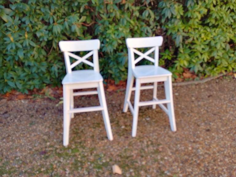 Pair of white high chairs for children