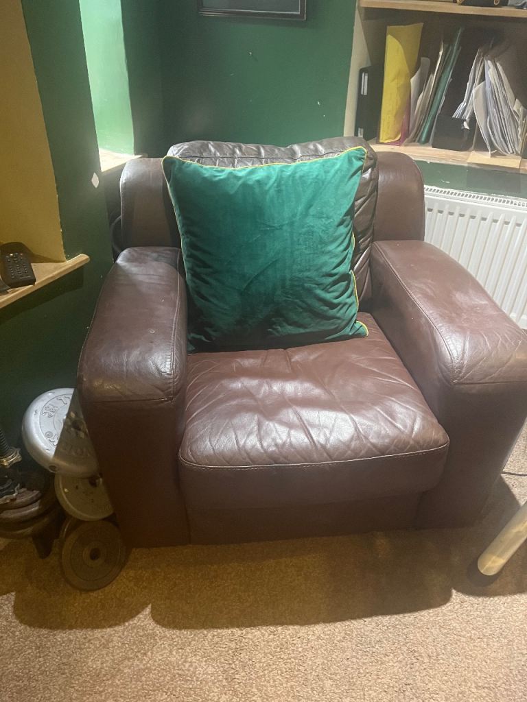 Two leather armchairs plus footrest