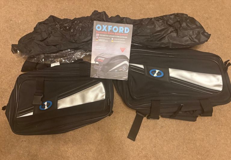 Oxford panniers with rain covers. 