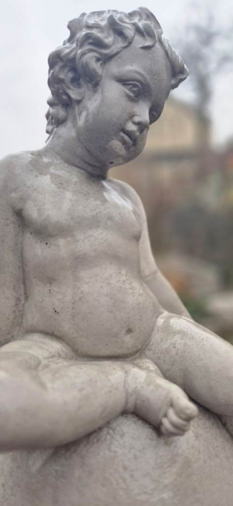 Concrete garden statue / cherub on plinth 