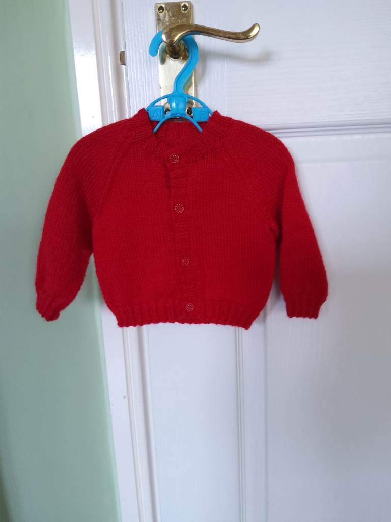 New, hand knitted baby cardigan 