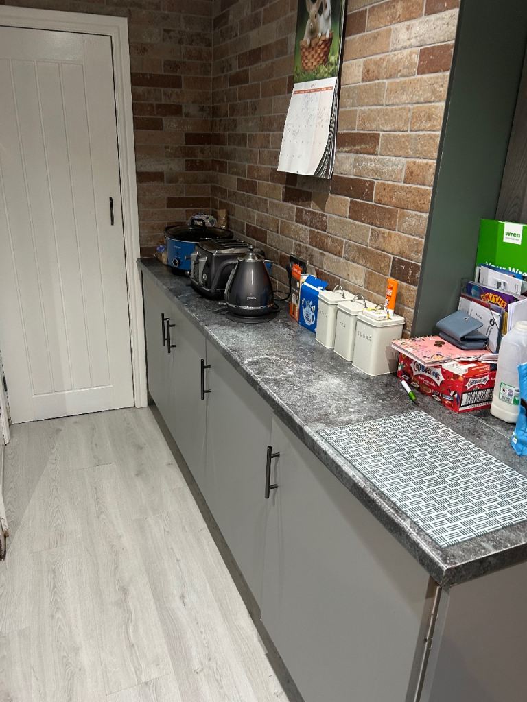 Kitchen full units tops integrated freezer dish washer hob and sink with taps