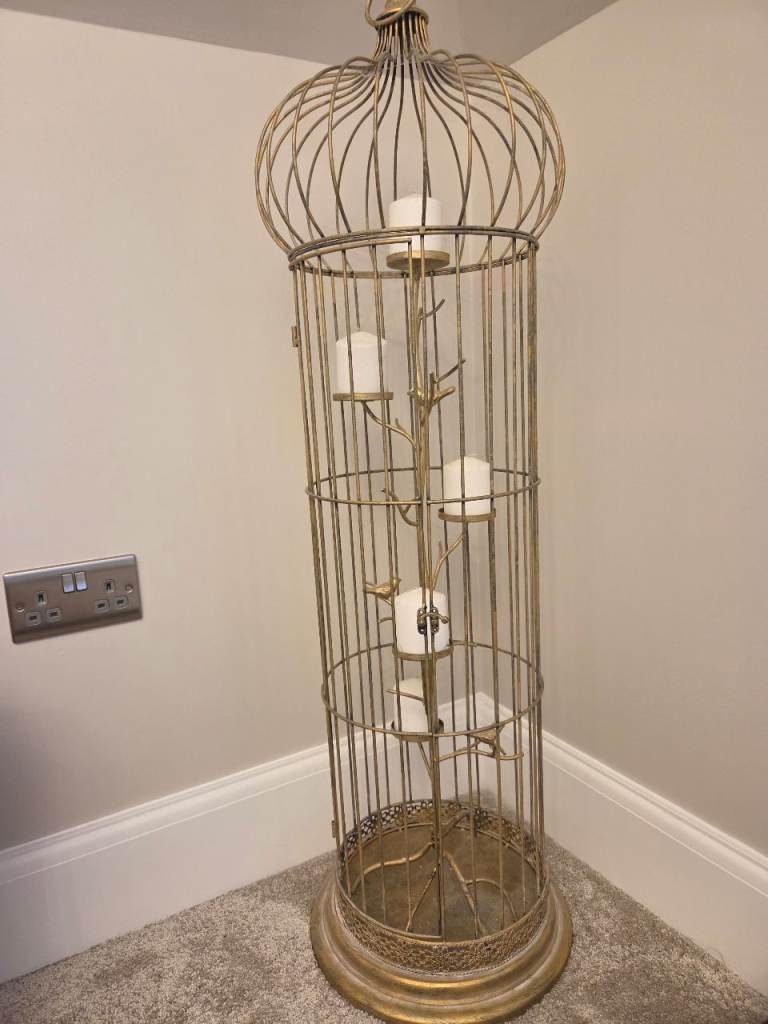Decorative bird cage with candle holders