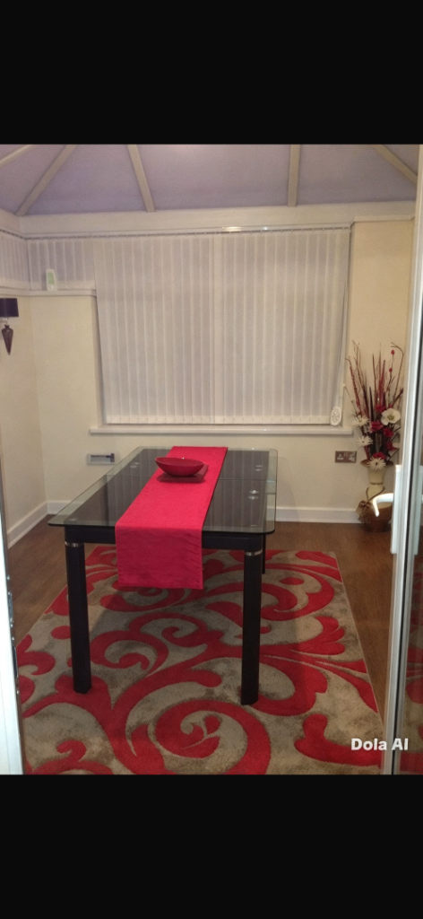 Black Glass Top Dining Table with metal legs 