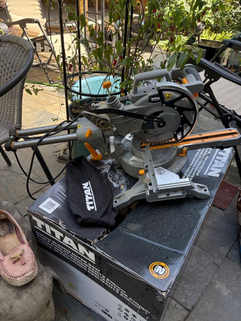 Titan 210mm sliding mitre saw used once for one job no longer needed