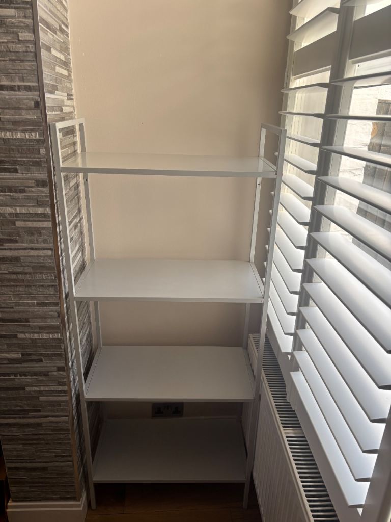 White IKEA JONAXEL shelving unit