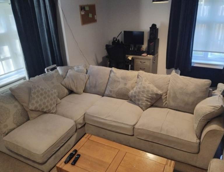 Comfortable Grey Fabric Corner Sofa with Matching Footstool – Very Good Condition