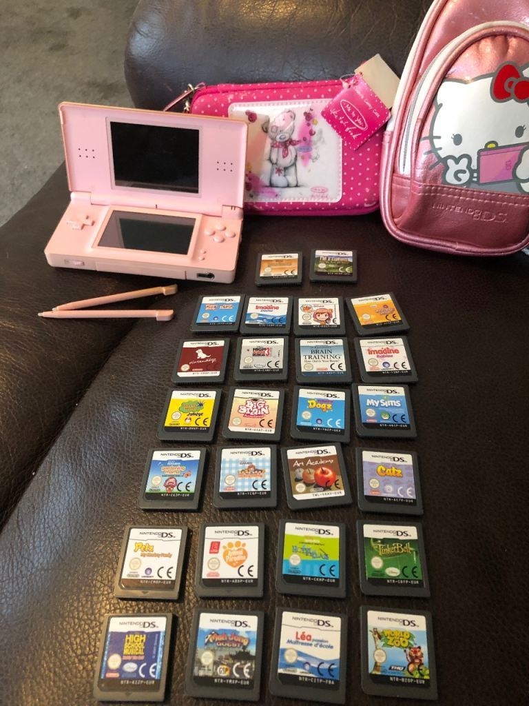 Pink Nintendo DS Lite Console The console needs a charger with 25 Games & Hello Kitty Case
