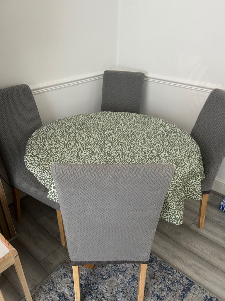 Glass Round Dining Table with Wooden Base and 4 Grey Chairs