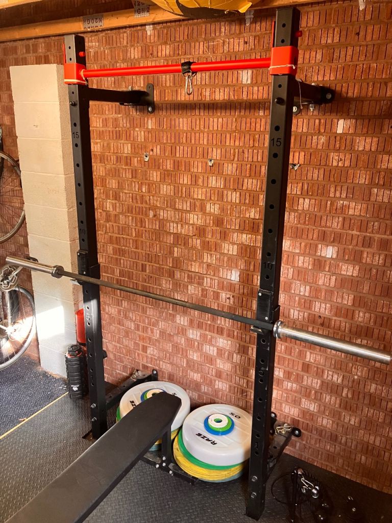 Squat rack + Olympic barbell + weights 