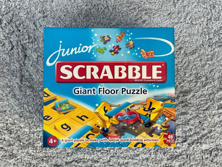 Junior Scrabble Giant Floor Puzzle, including 49 puzzle pieces and 26 letter tiles.