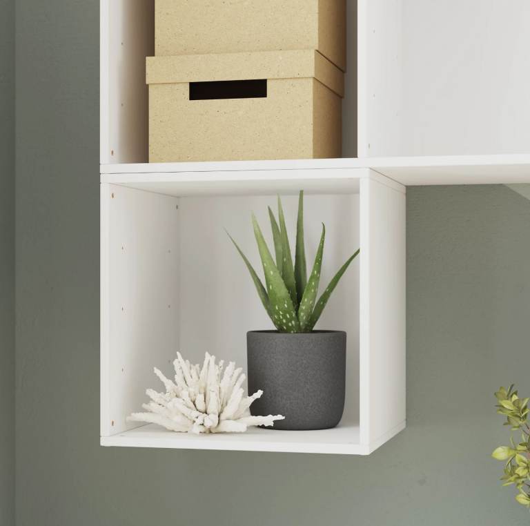 Three white storage cubes