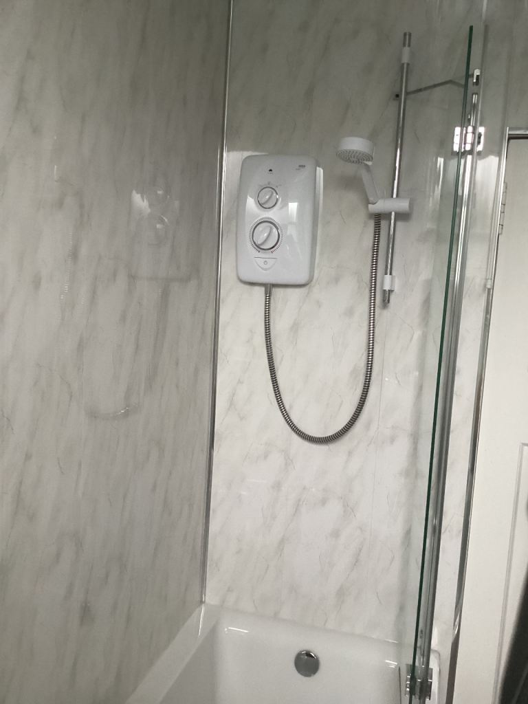 Beautiful bath with shower and shower screen