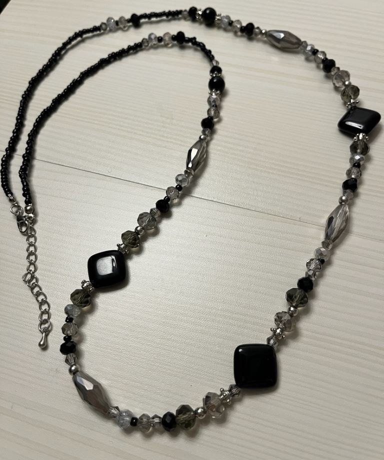 Brand new black and silver beaded long necklace