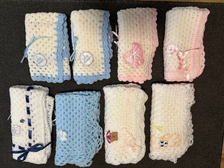Beautiful handmade crocheted baby blanket in a soft light blue & Pink