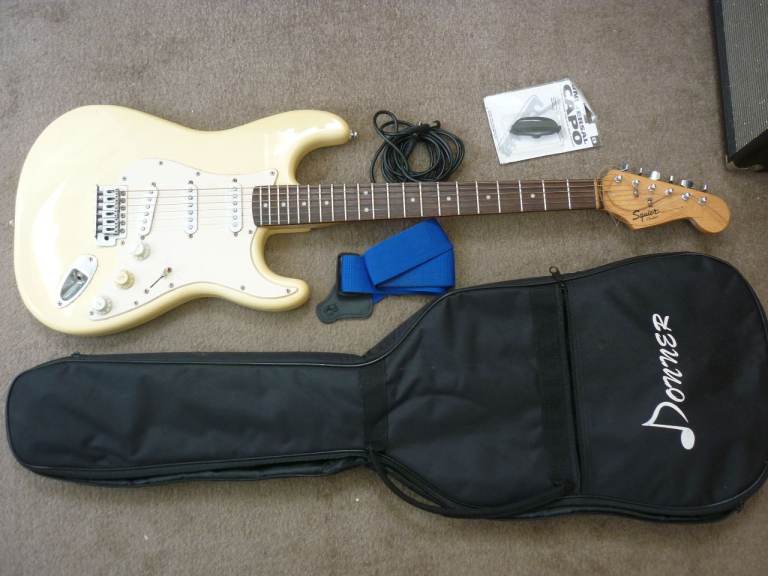 Fender squire stratocaster and an amplifier