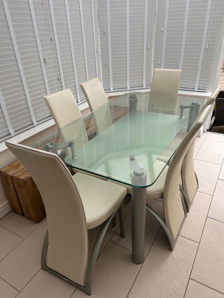 Glass Dining Table with 6 Cream Faux Leather Chairs – Good Condition