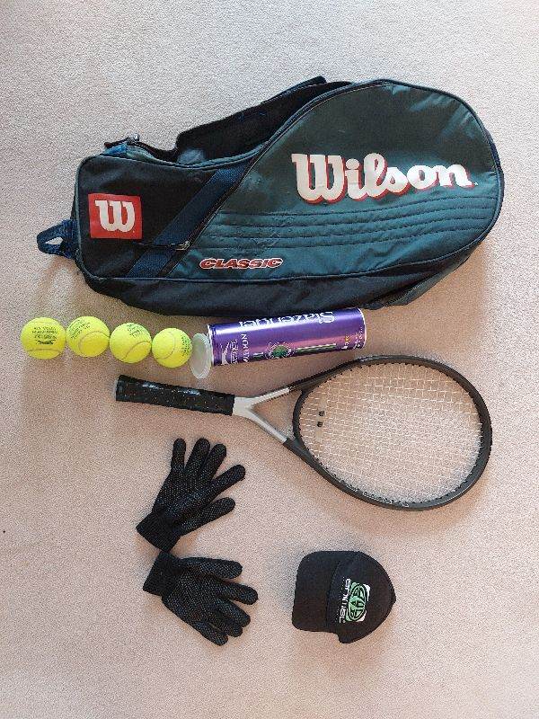 Tennis racquet with equipment