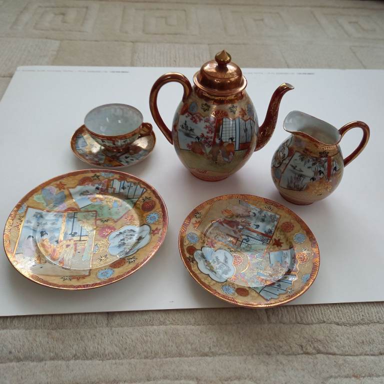 Japanese tea set. Attractive red and gold design.