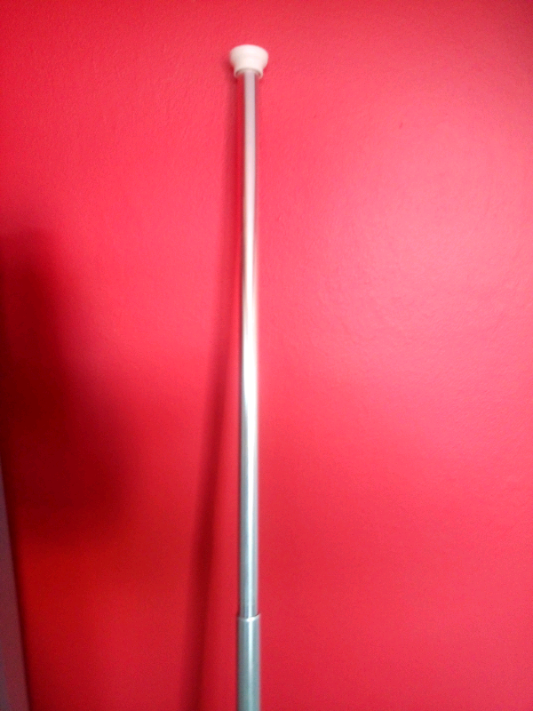 Spring loaded shower curtain rail
