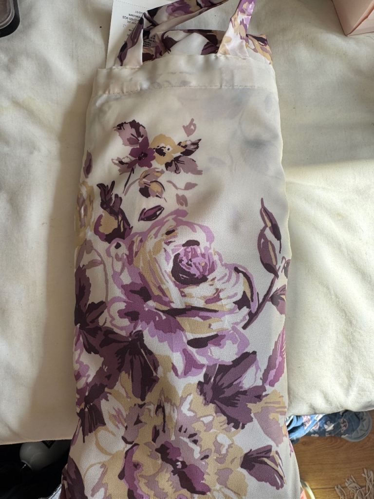 Brand new shower curtain with a lovely floral pattern in purple