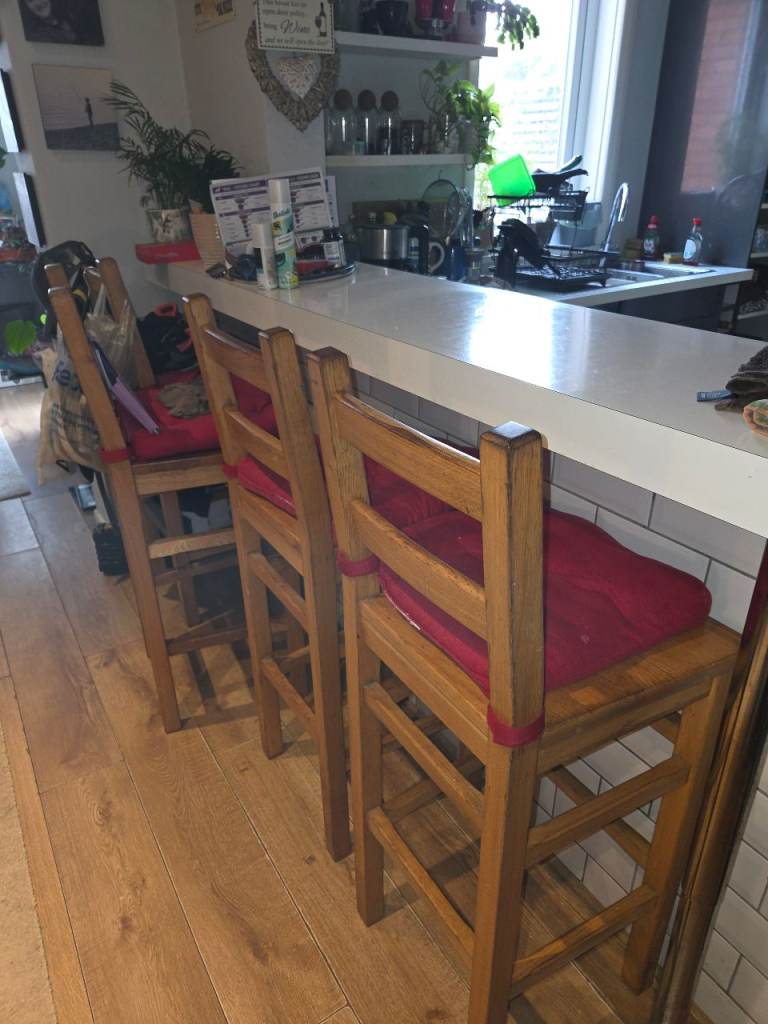 SOLID WOOD BAR STOOLS X 4