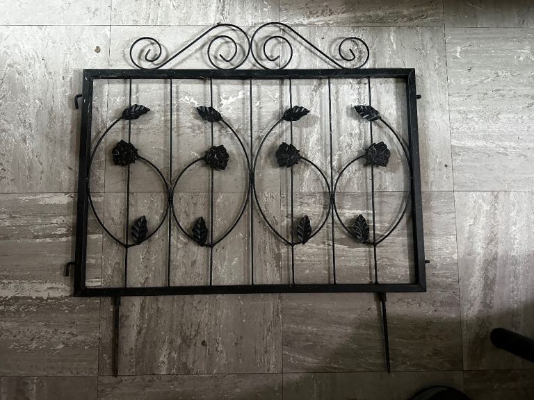 8 decorative black metal garden border/fence panels with rose and leaf design.