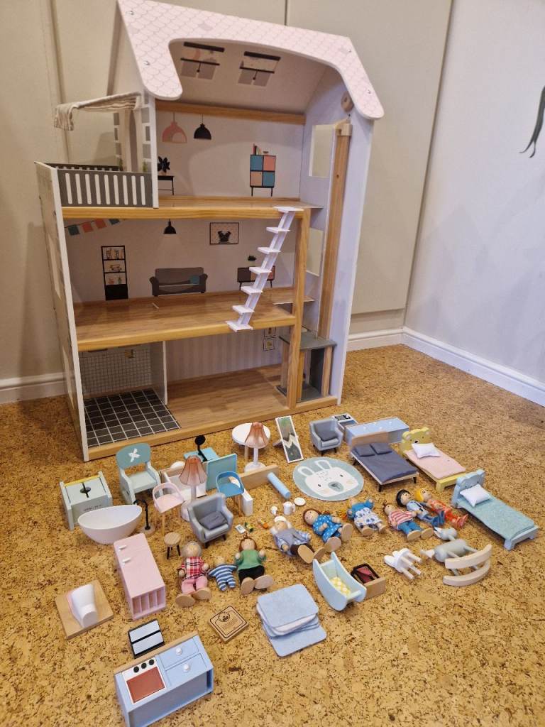 Dolls house with furniture and figures