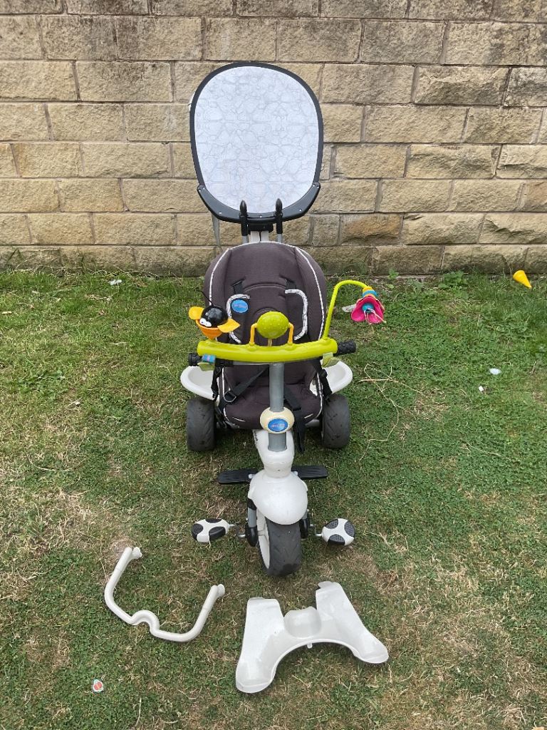 Unisex smart trike in cream and black with detachable bag,toy bar and sun canopy 
