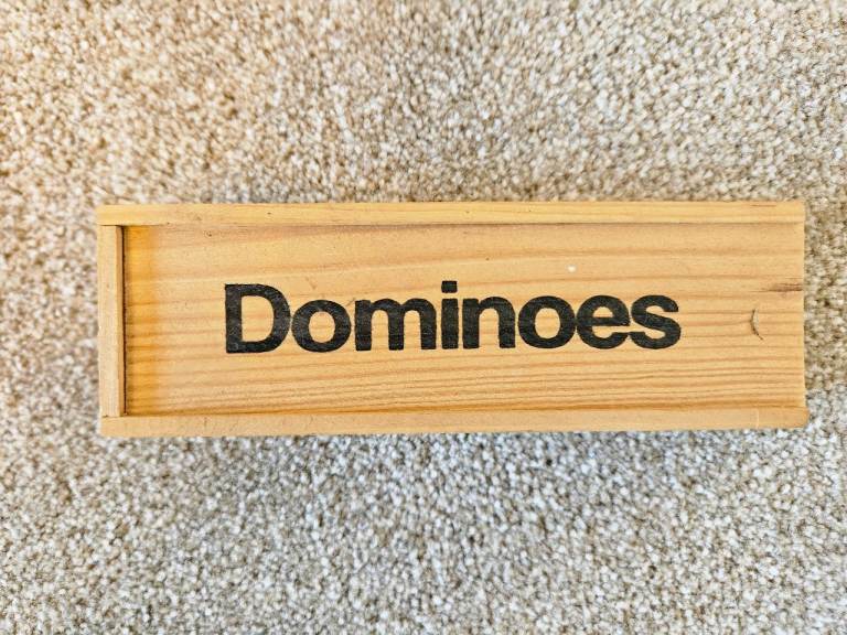 Dominoes in a wooden box 