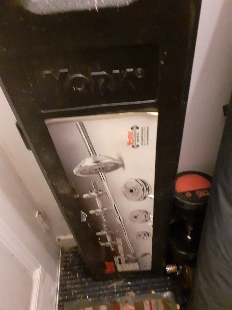 image for Weights and bars in a pull on wheels case with fittings for fulll sets.