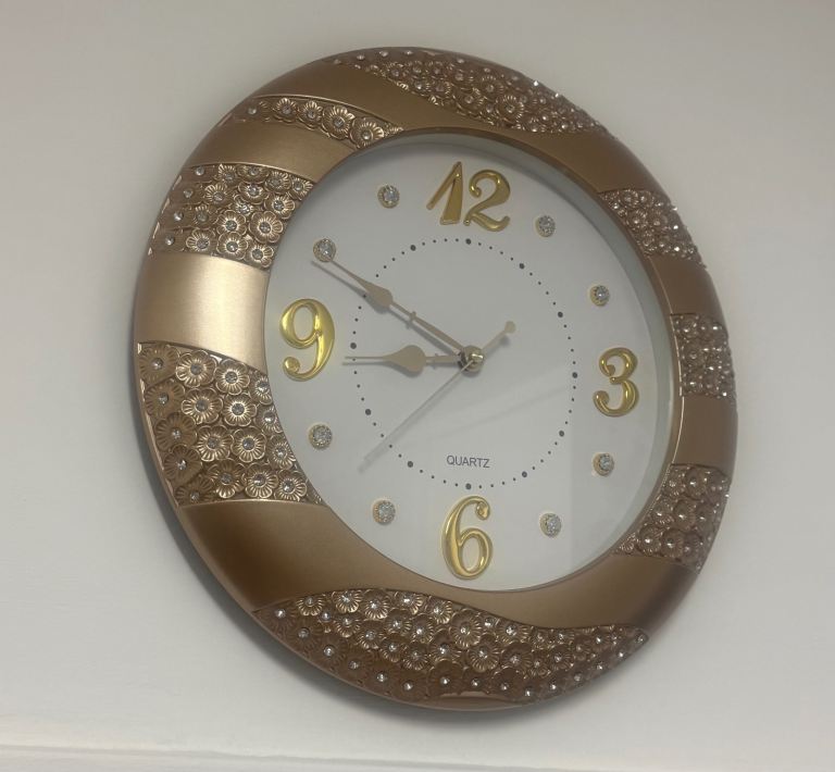 Stories Decorative gold Color Wall Clock