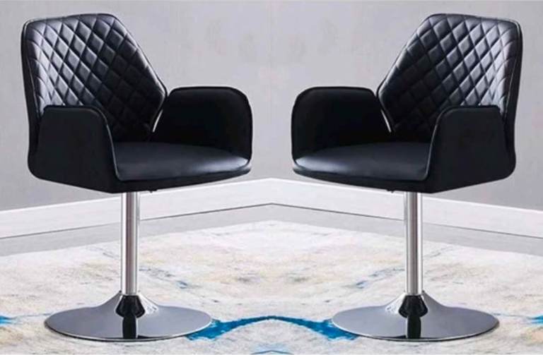 Brand new 2 black swivel faux swivel dining chairs