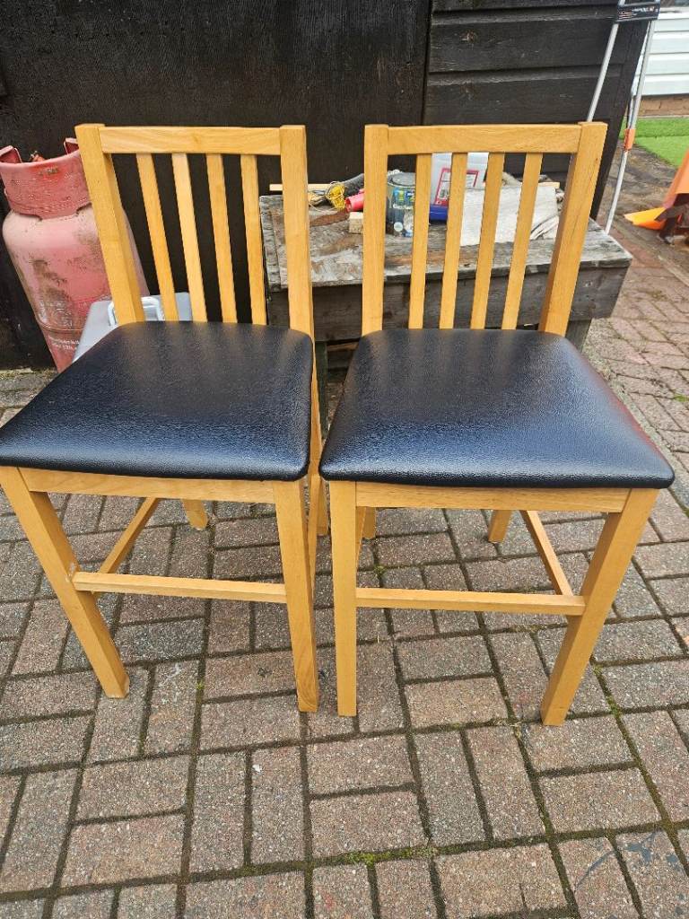 Pair of Wooden Dining Chairs with Black Faux Leather Seats – Good Condition