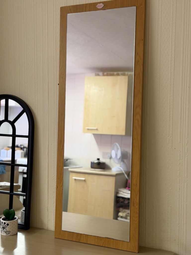 full-length oak-framed mirror
