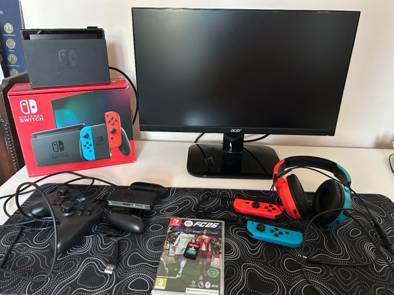 Nintendo Switch console with monitor, headphones, extra controller and FC26