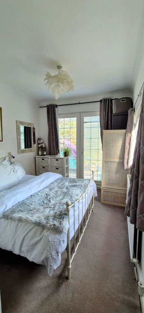 Light room with  patio door to garden