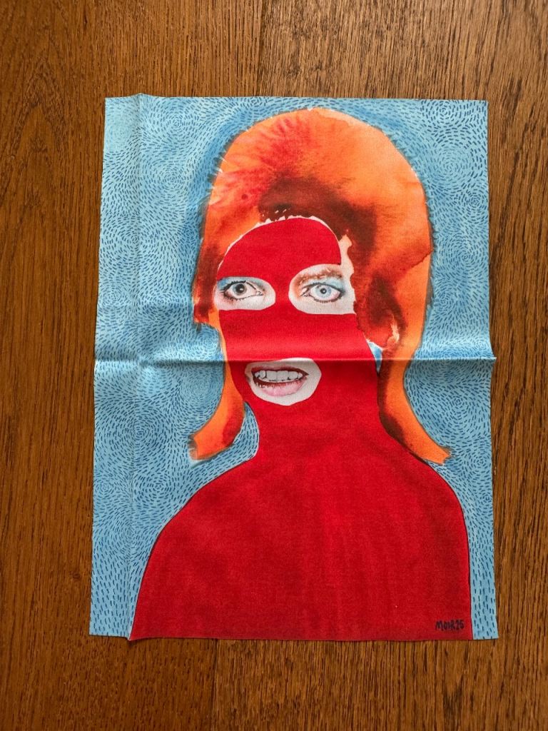 Glasses cleaning cloth featuring the "Bowie in Red Ski Mask" artwork by artist Jim Moir.