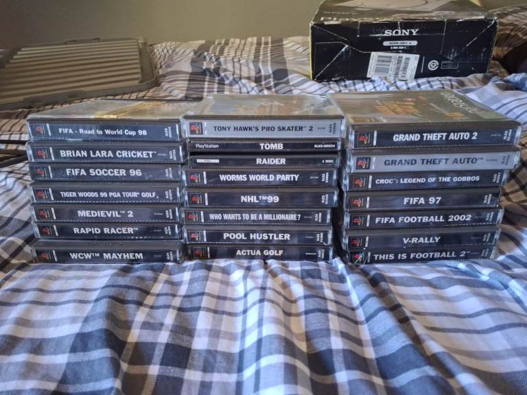 Ps1 console with 21 game bundle and Steering wheel and Foot pedals.