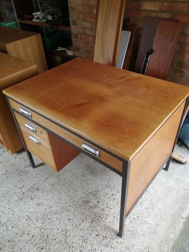 Office desk and storage cupboards. 