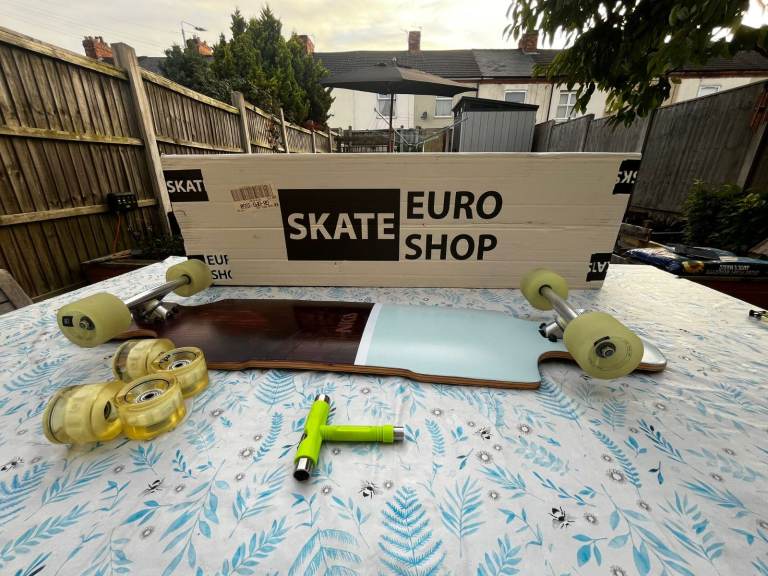 Skateboard Long board in its box + extra wheels