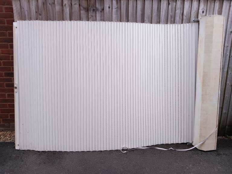 Large shutter for patio door with side rails and cover lid. 