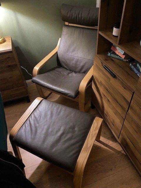 IKEA Poang Armchair and footstool. Oak veneer/Glose dark brown leather