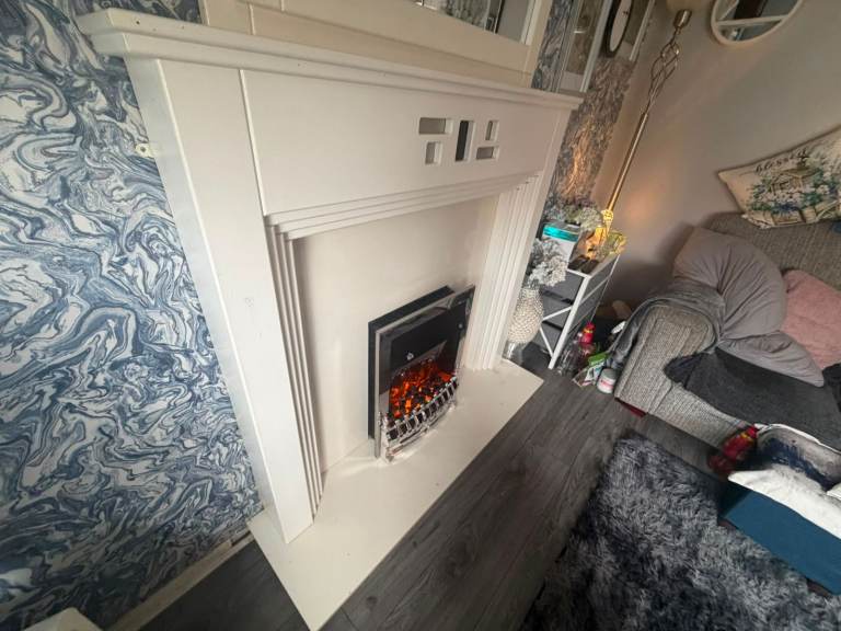 Really nice modern fireplace with mirror and electric fire inset £199