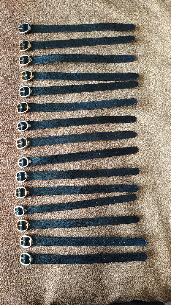 A bunch of 15 NEW black luggage straps