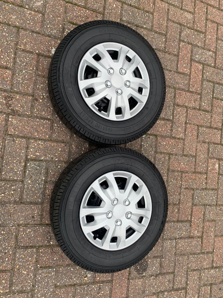 Pair of caravan wheels with tyres and hub caps
