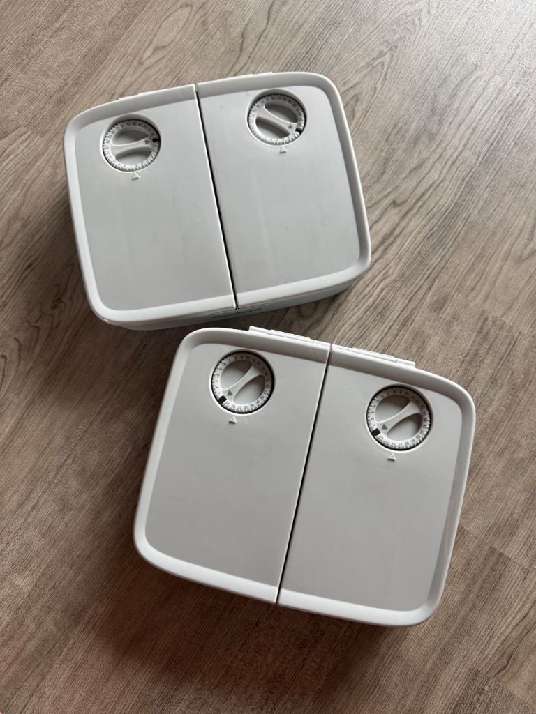 Set of two battery operated timed cat feeders
