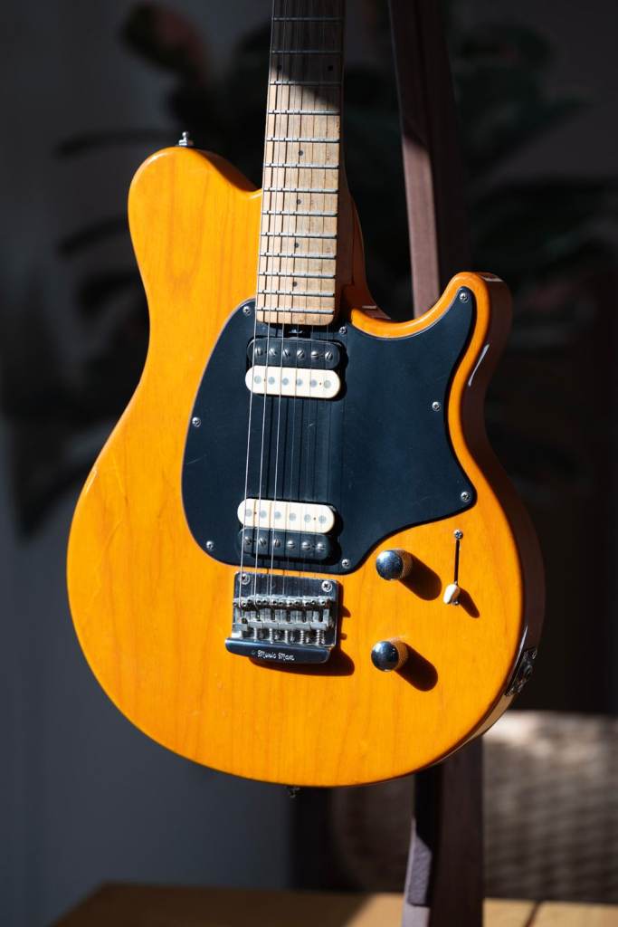 1998 Ernie Ball Music Man Axis Sport HH Hardtail in Translucent Orange