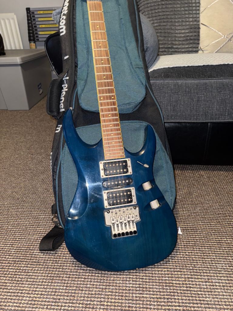 This stunning, rare, and collectable electric Maverick F3 guitar is in translucent blue