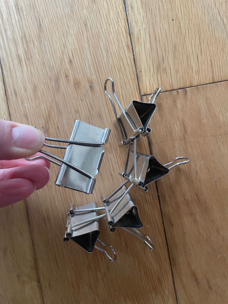 Five metal bulldog clips 